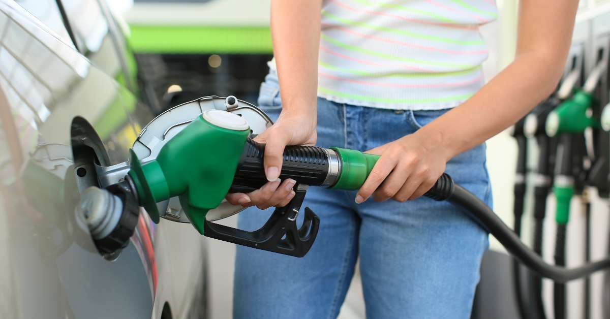 woman filling up car tank