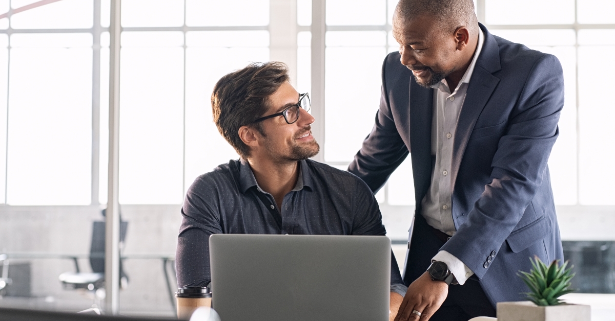 businessman helping new employee
