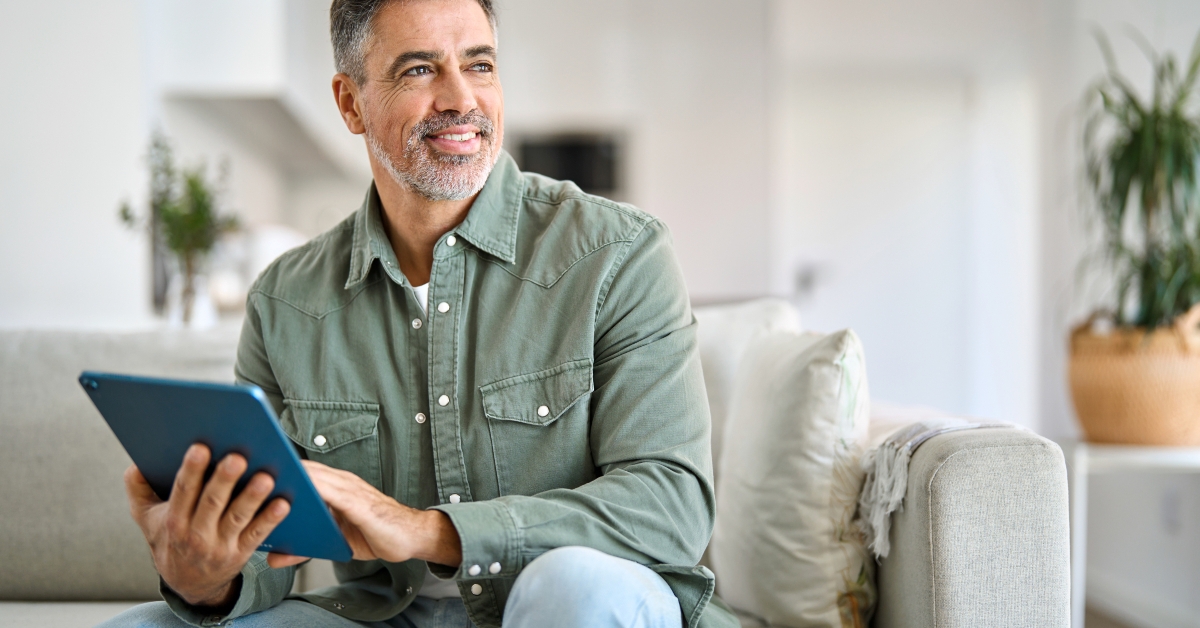 man using digital tablet 