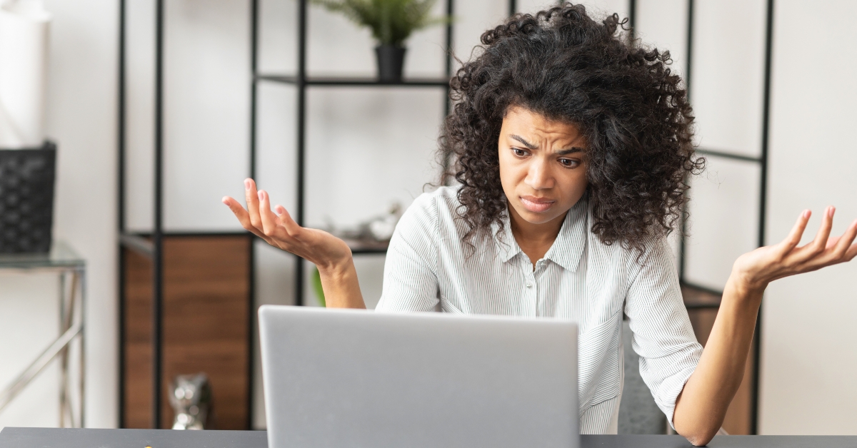 woman feeling stressed while working