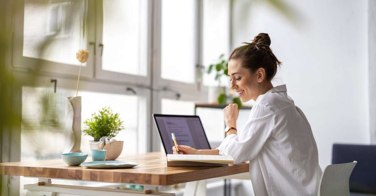 woman working on laptop in her studio