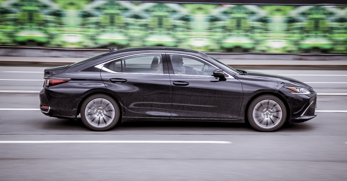 Black car Lexus ES 350 fast speed driving