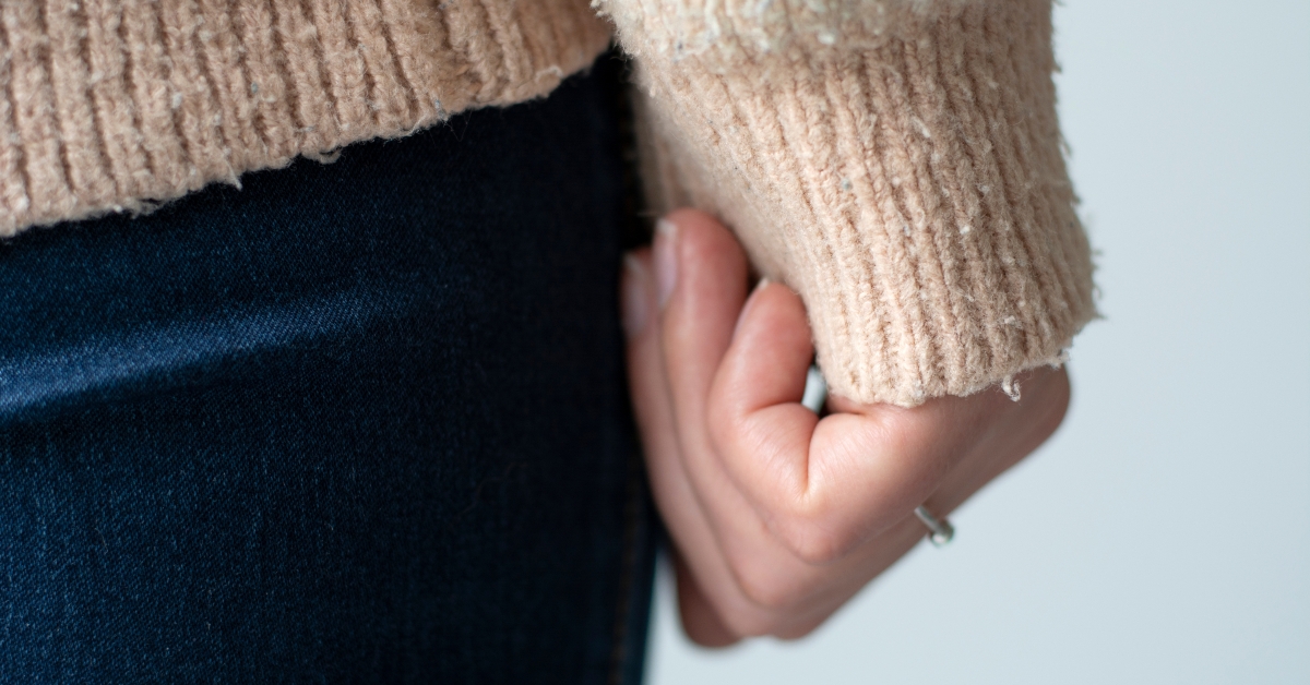 closeup woman wearing a old sweater