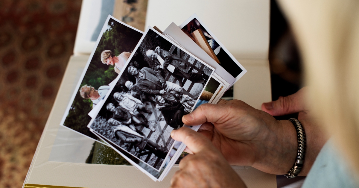 couple looking at family photo album 
