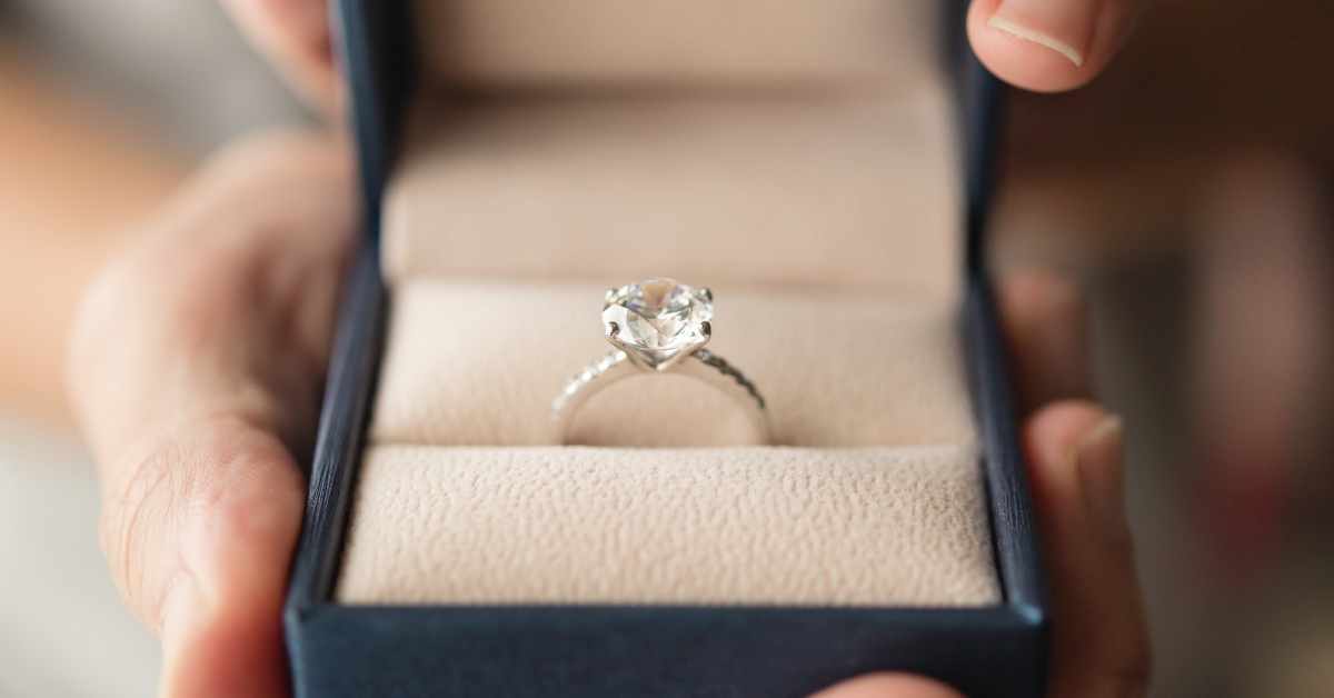 holding diamond ring in jewelry box