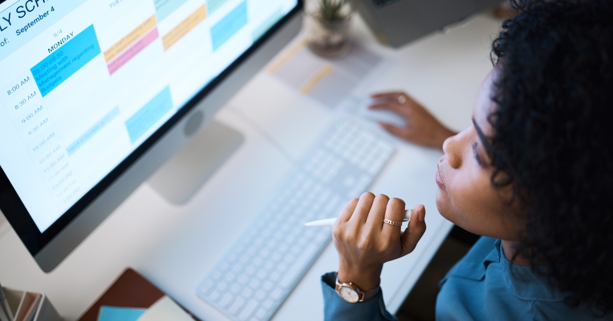 Woman with computer, thinking and checking schedule