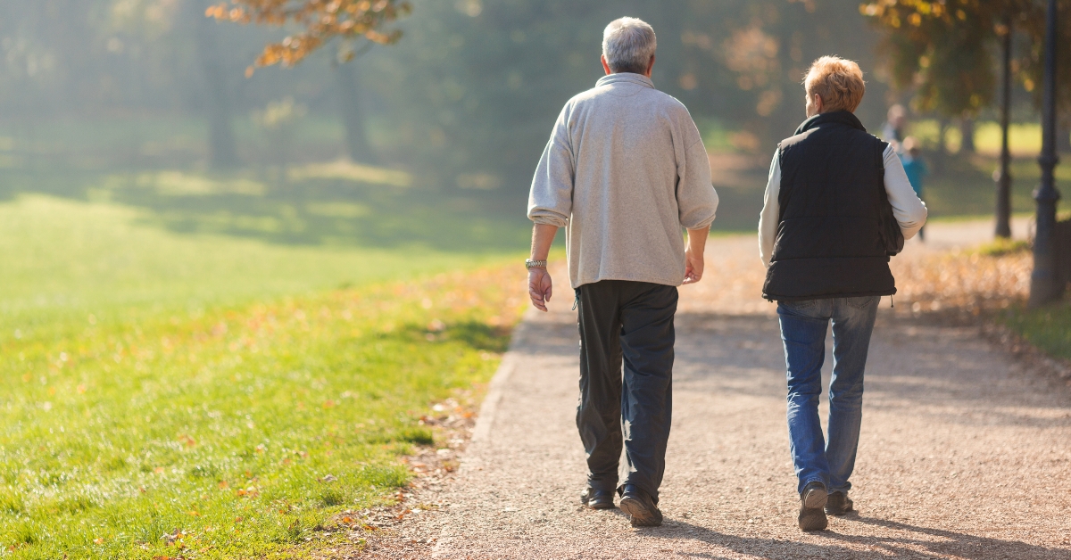 senior citizen couple taking a walk