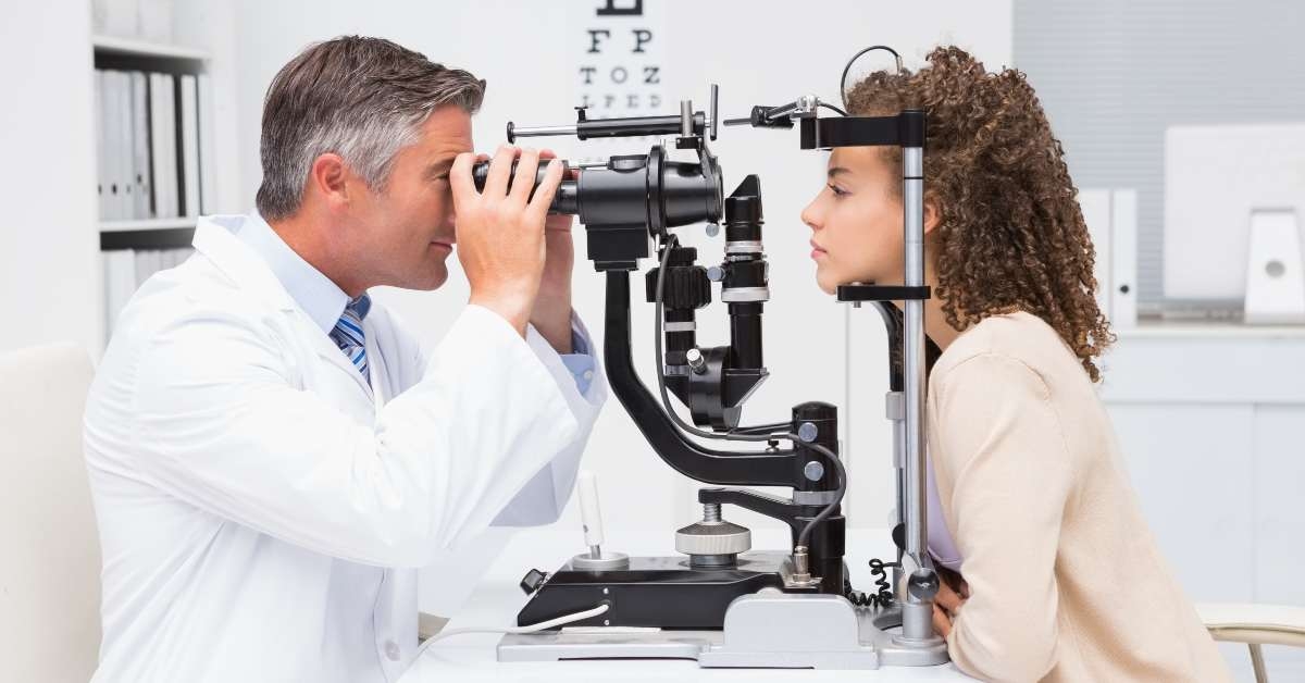 woman doing eye test with optometrist