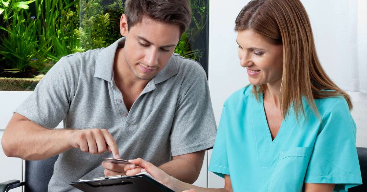 man paying through credit card