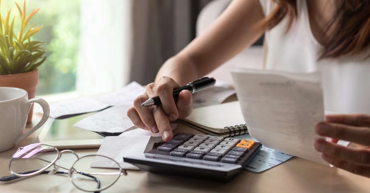 calculating expenses in the living room at home