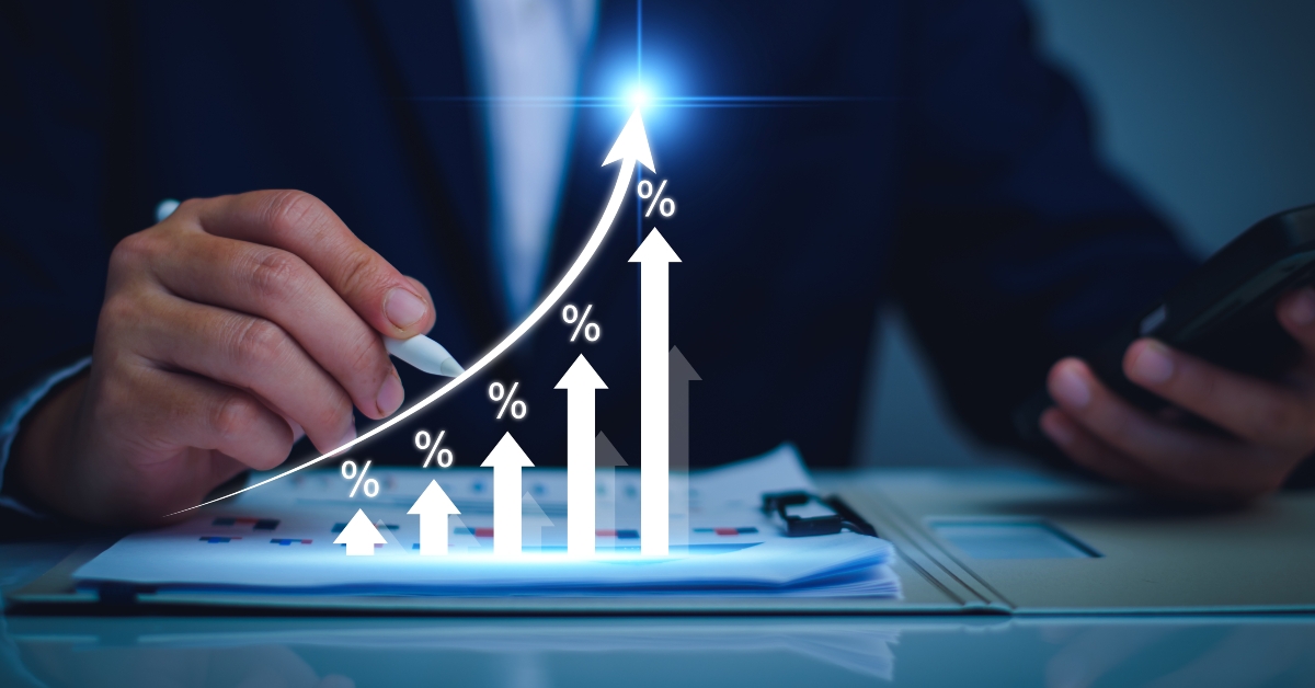 Businessman with percentage symbol and up arrow