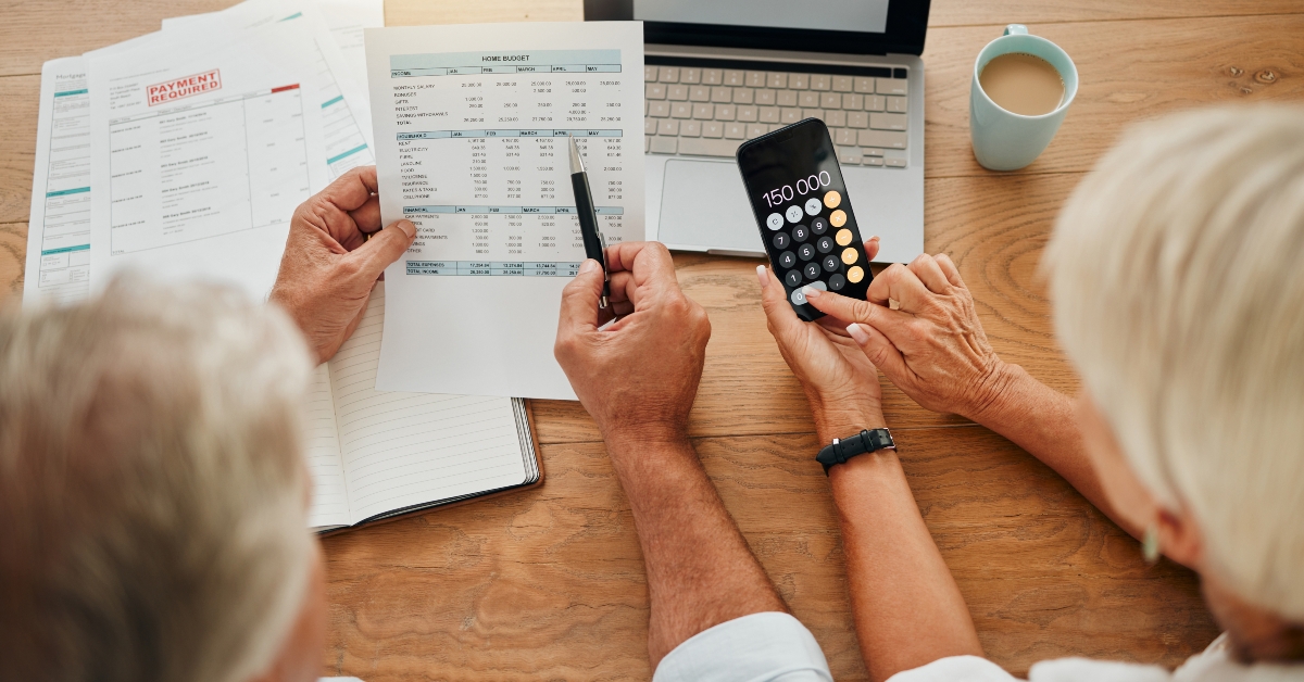 senior couple calculating their expenses