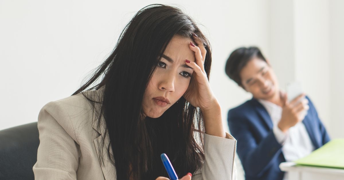 man goofing off annoyed female coworker