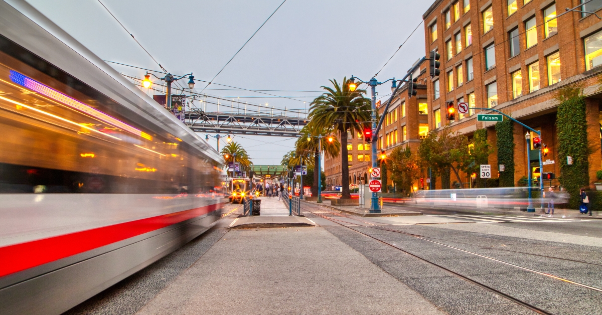 blurry vehicles passing on road