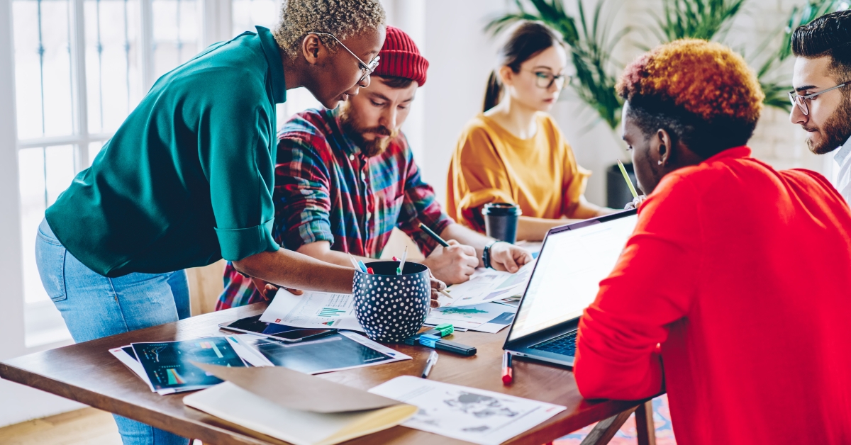 female leader checking work of crew