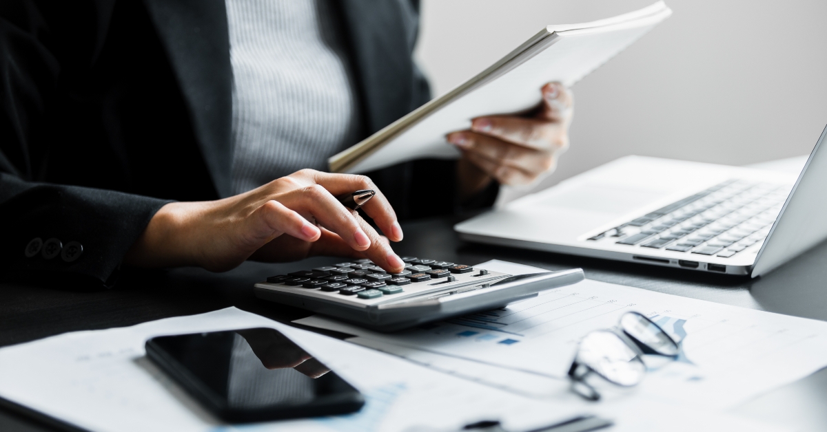 accountant using calculator