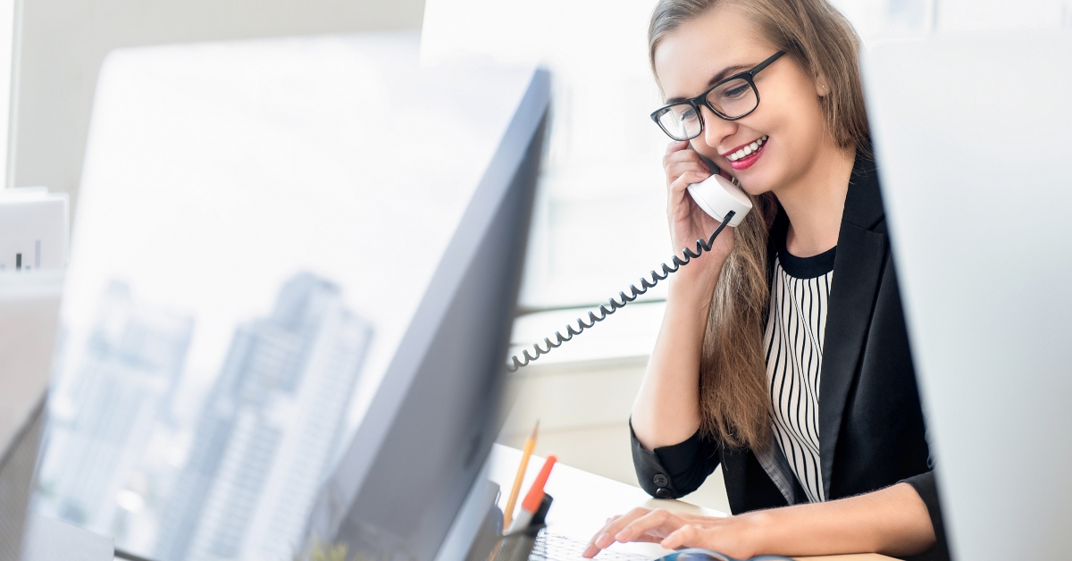 businesswoman talking on the phone with customer