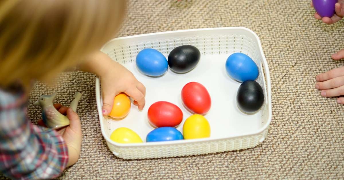 children pick up a musical shaker