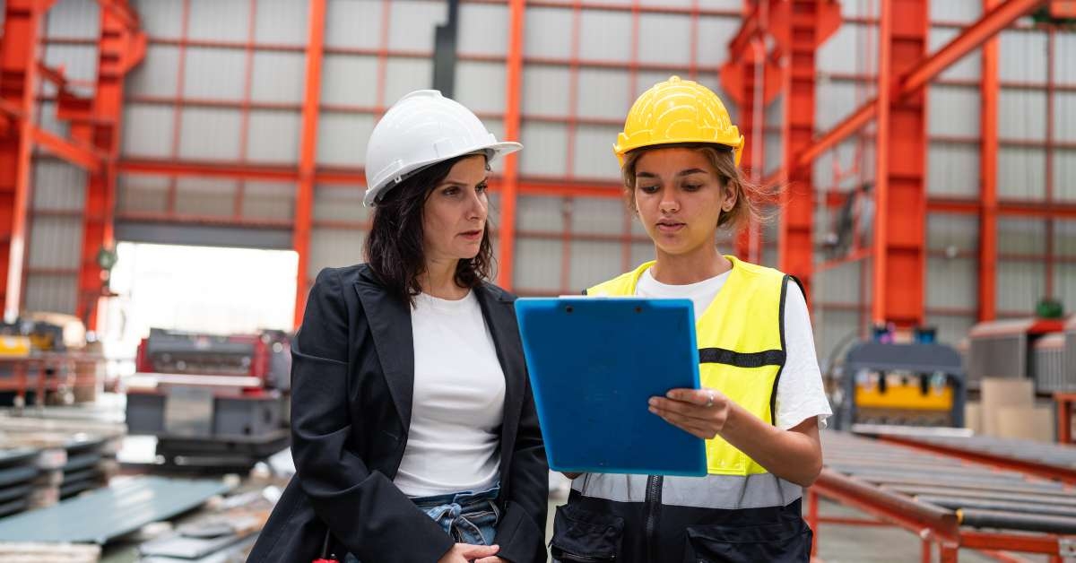 engineer and manager wearing safety vests and hats