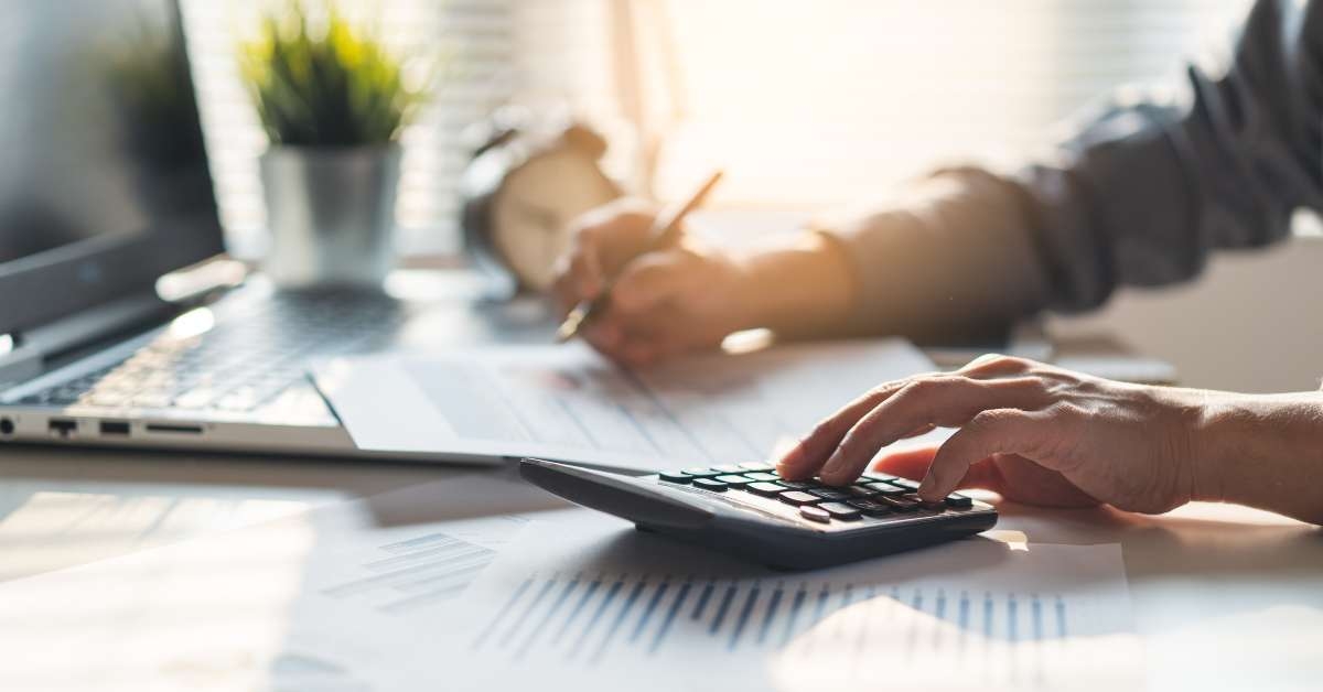 businessman calculating business balance