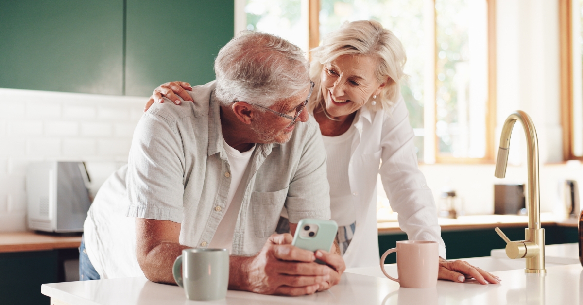 happy senior couple in kitchen