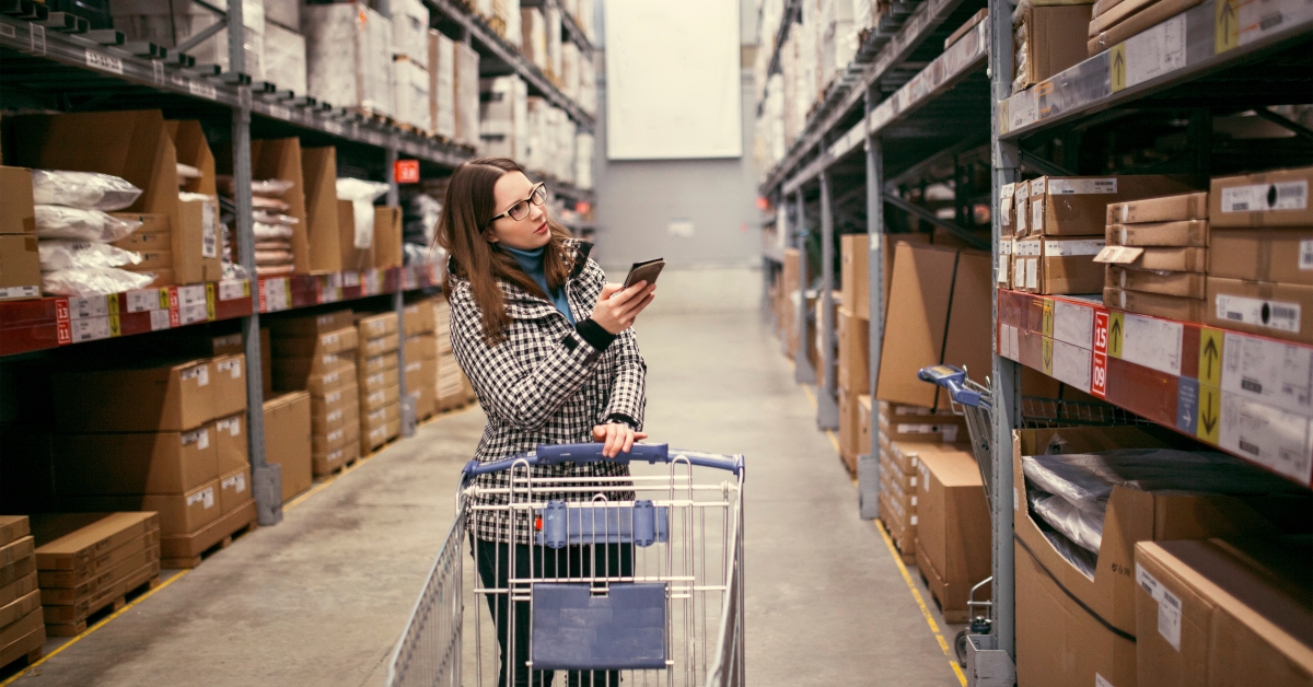 woman looking for goods on the shelf 