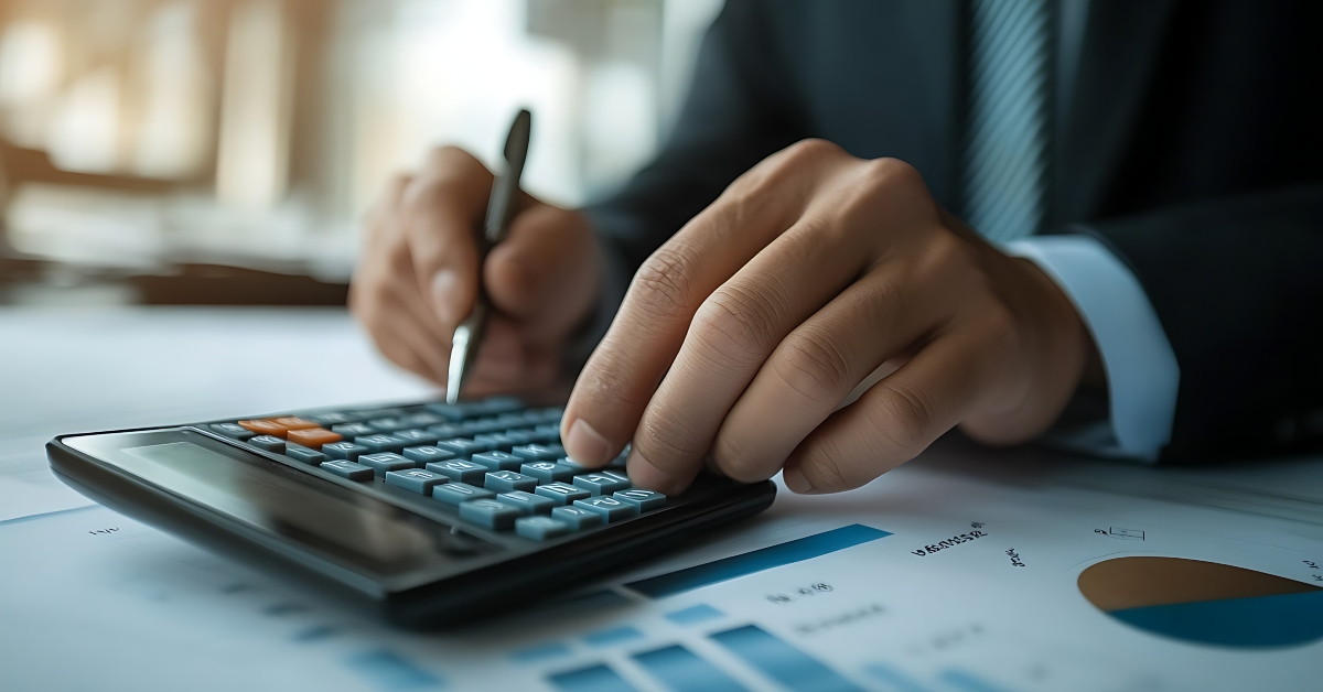 businessman calculating interest using calculator