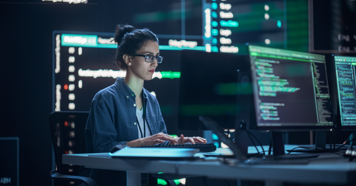 Female Programmer Working in Monitoring Control Room