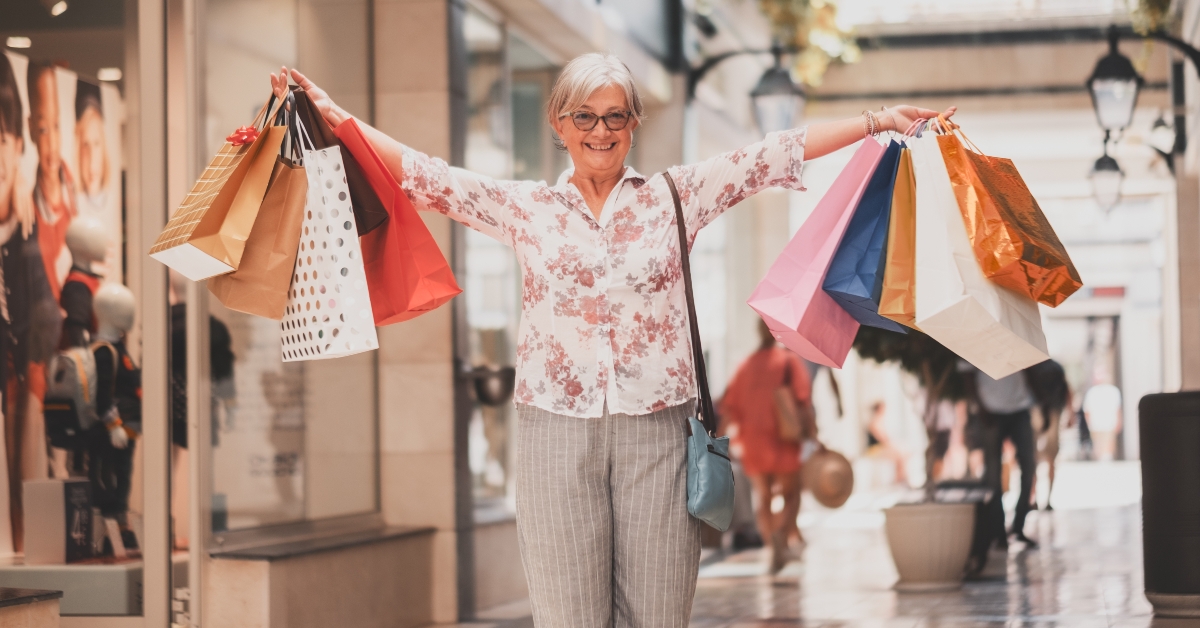 woman holding shopping bags looking happy