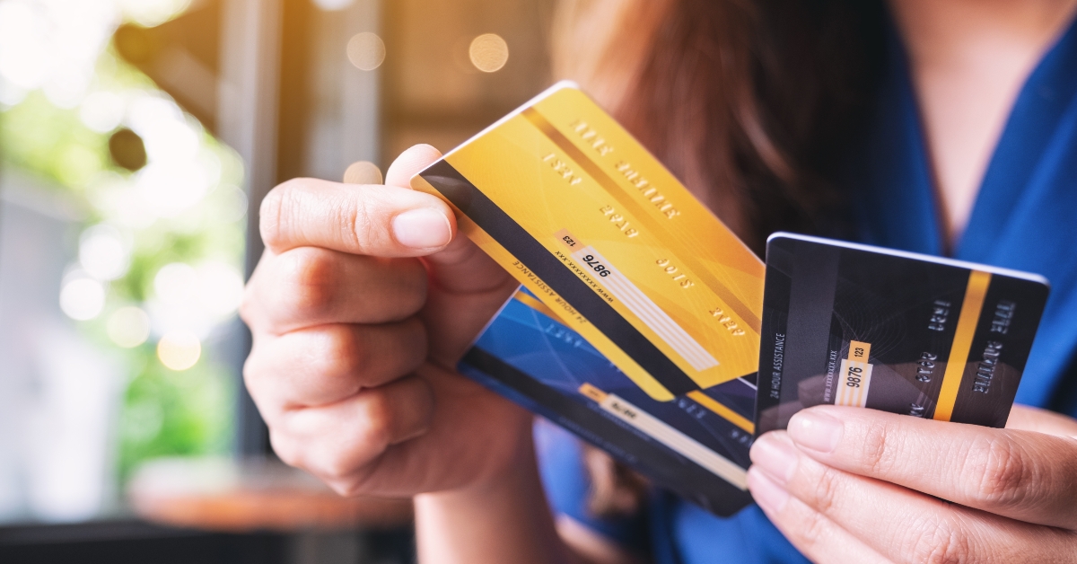 woman choosing credit card to use 