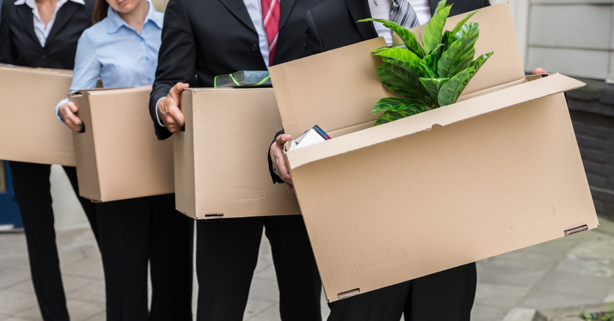 businesspeople with cardboard boxes