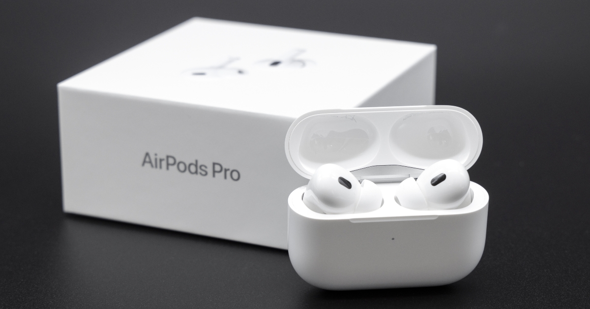 AirPods Pro inside case next to packaging box