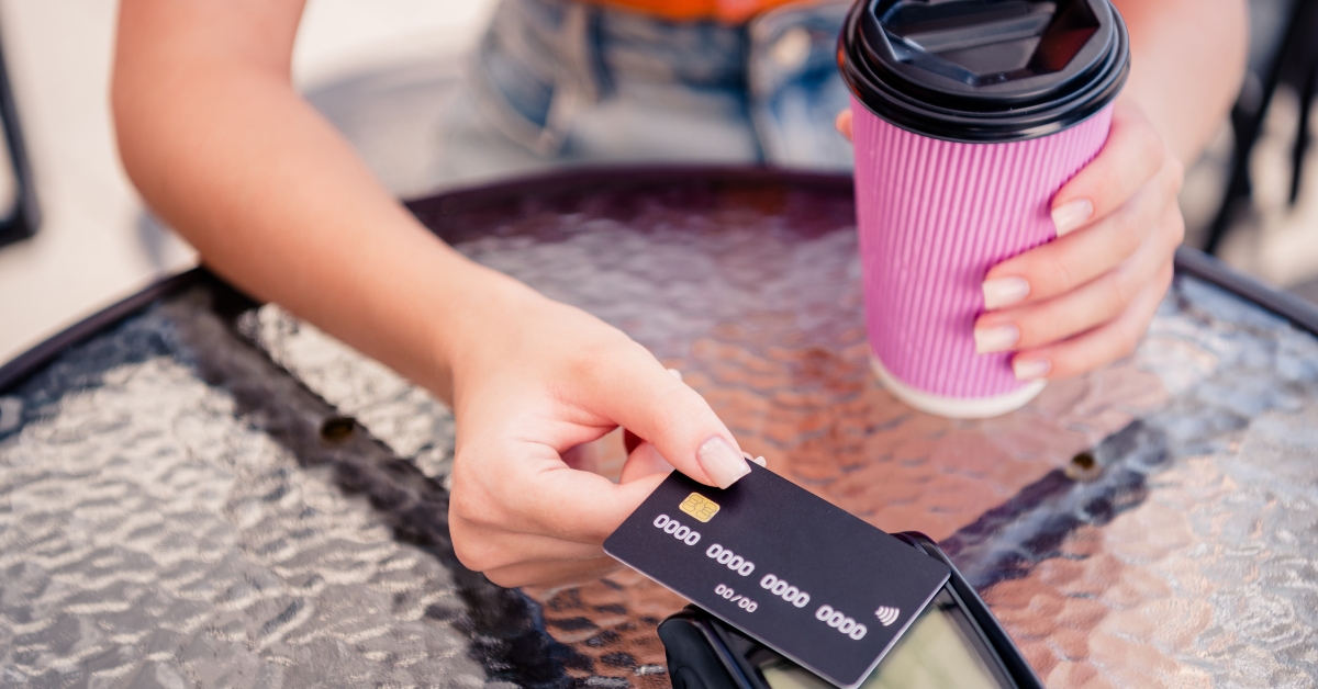 girl paying using credit card