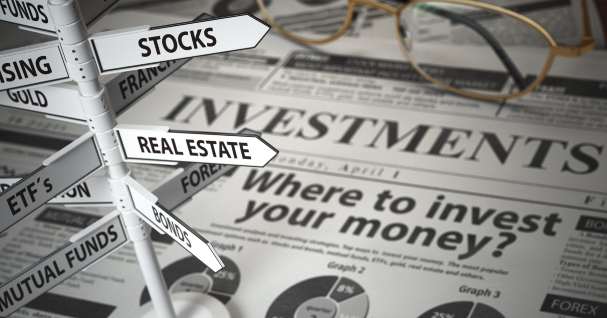 newspaper and direction sign with investment