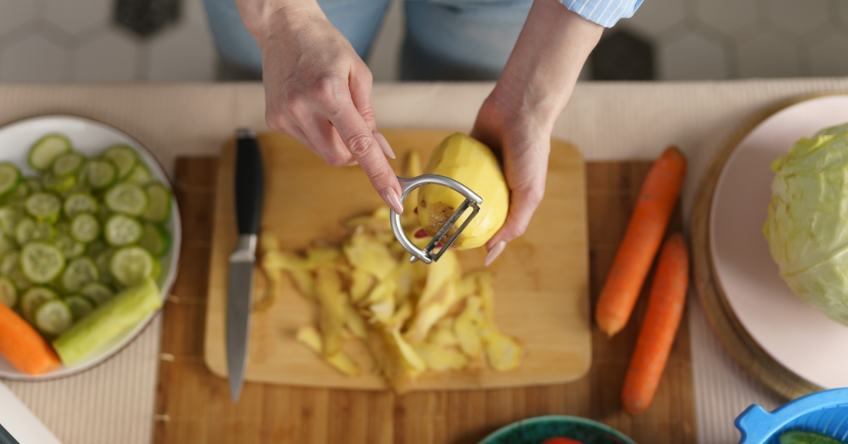 woman peeling potato