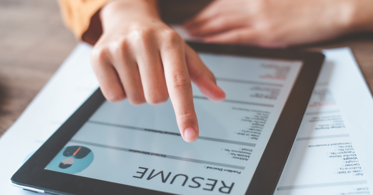 person filling out personal resume