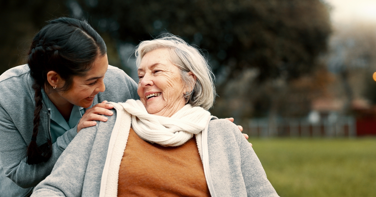Caregiver helping woman with disability