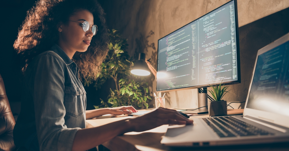 woman writing codes working late night