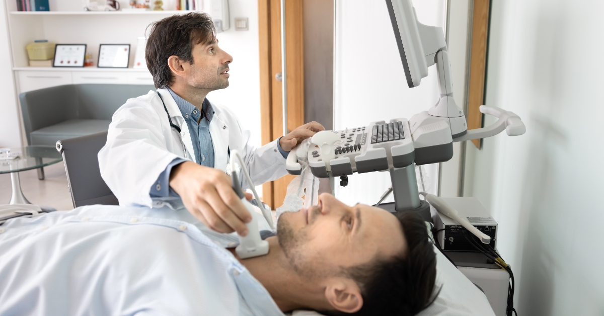 performing thyroid ultrasound exam