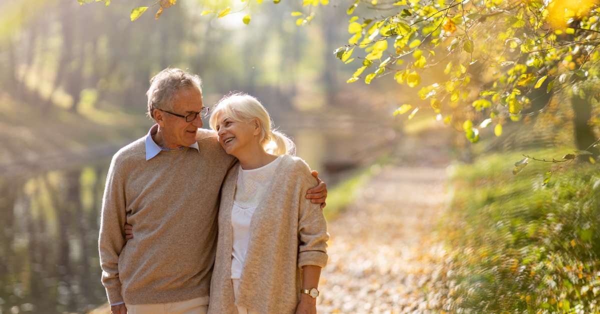 happy senior couple in autumn park