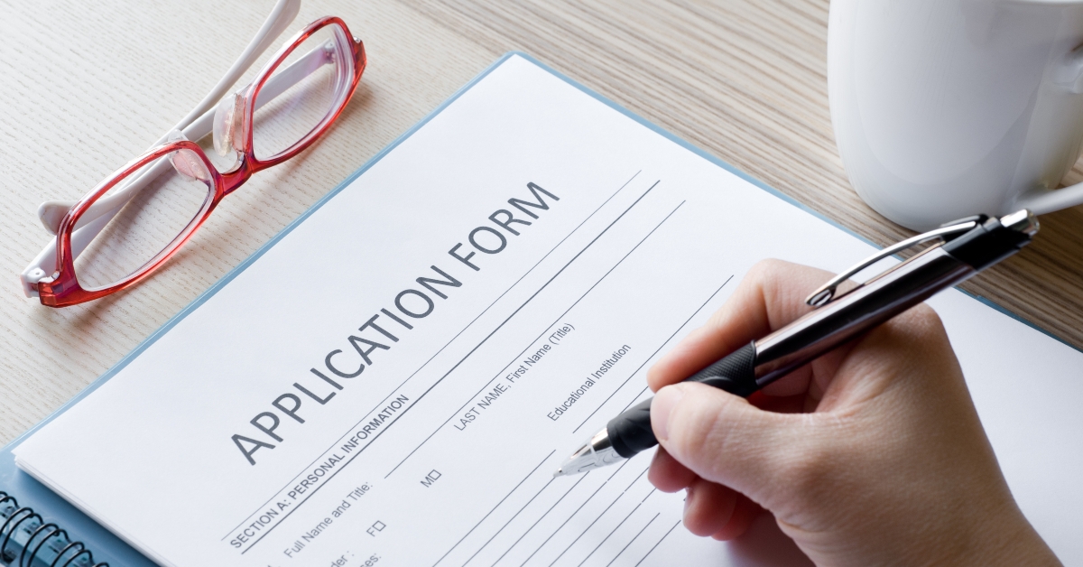 a person signing an application form
