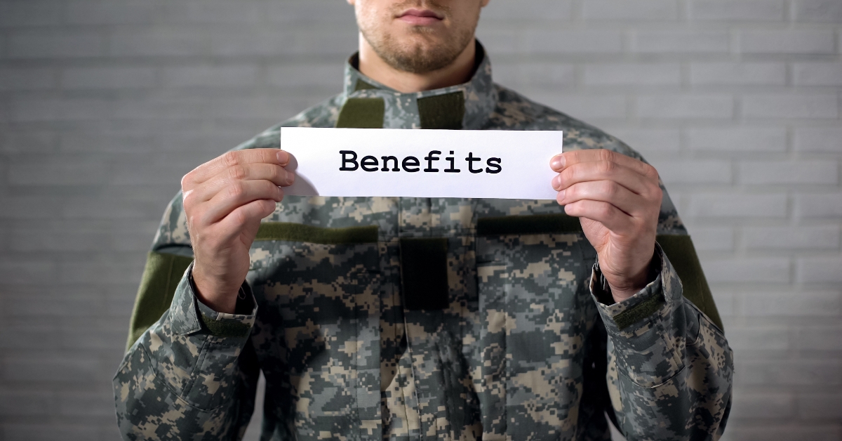 benefits word in hands of male soldier