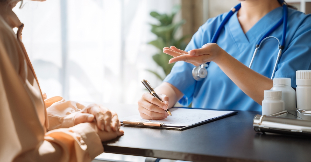 Female doctor consulting senior old patient