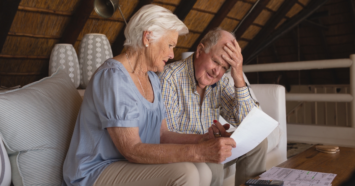 Senior couple discussing over medical bills