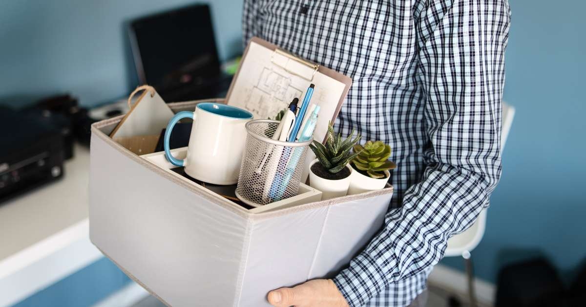 holding a box with personal items