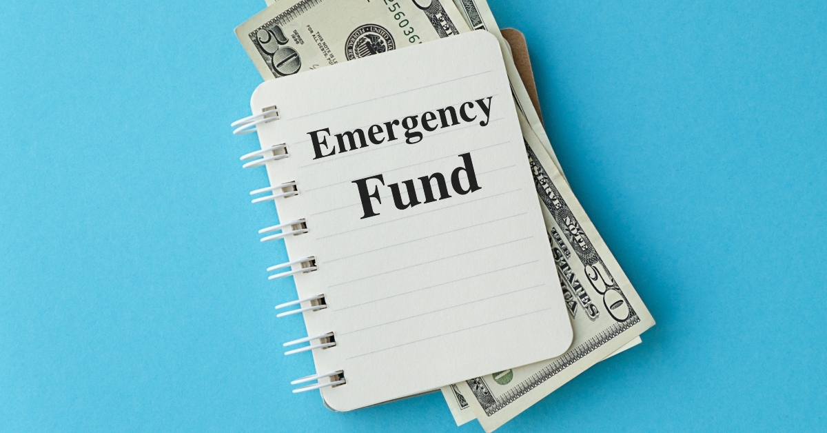 A notebook with a dollar bill on top