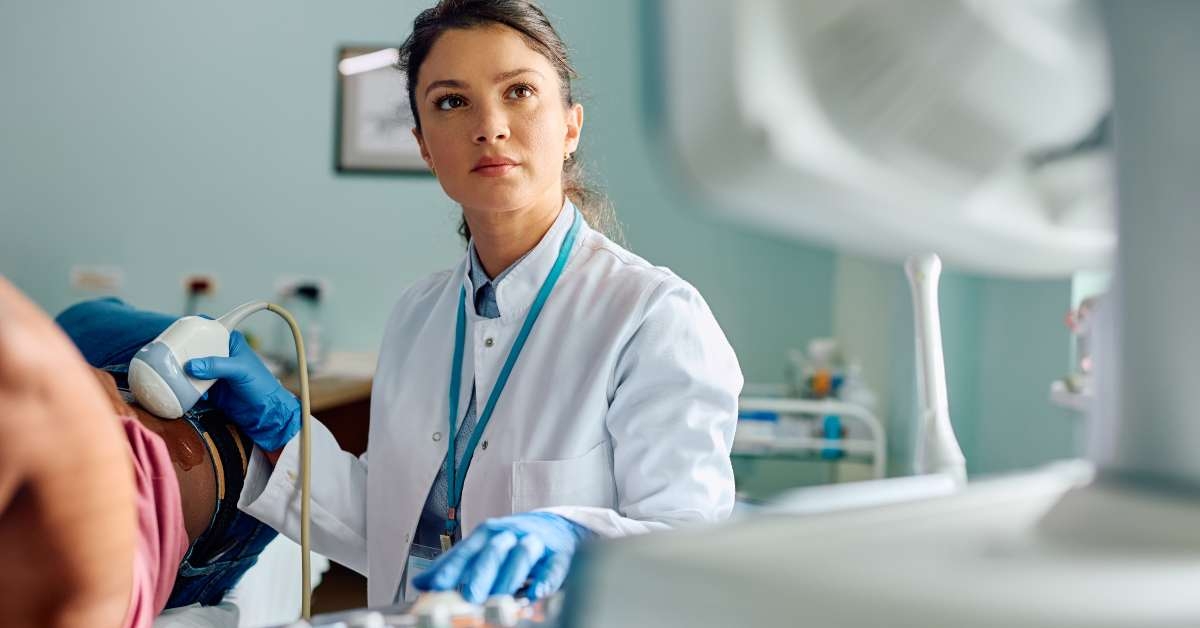 doctor examining black female
