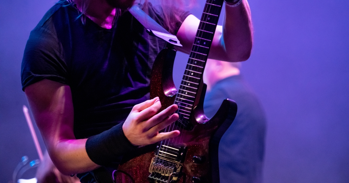 man playing electric guitar