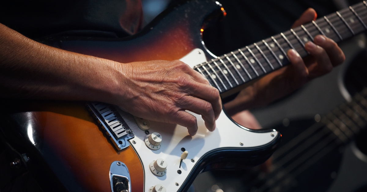 playing on an electric guitar