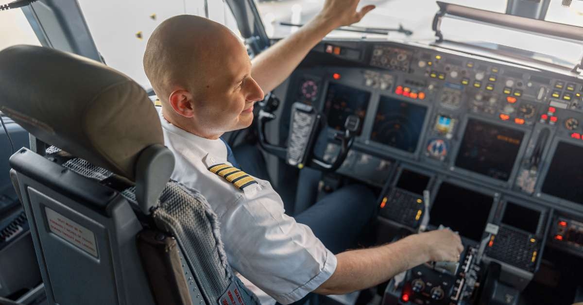 pilot sitting in an airplane cabin